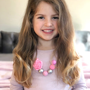 Girl wearing pink and silver bubblegum bead necklace from Happyful NZ